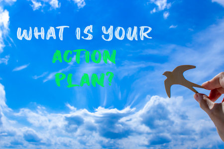 What is your action plan symbol. Concept words What is your action plan on beautiful blue sky. Beautiful blue sky background. Businessman's hand. Business what is your action plan concept. Copy space.の写真素材
