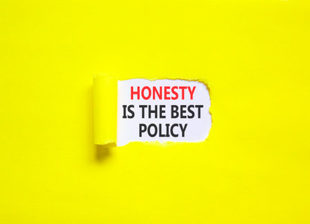 Honesty is the best political symbol. Concept words Honesty is the best policy on beautiful white paper. Beautiful yellow paper background. Business honesty is the best policy concept. Copy space.の写真素材