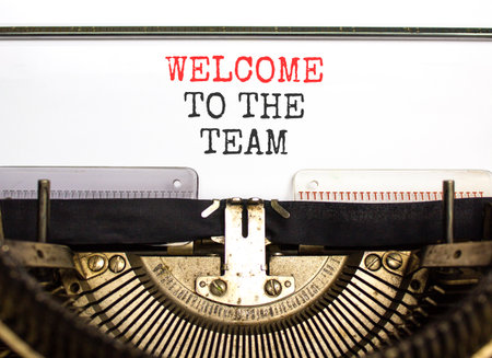 Support, help welcome to the team symbol. Concept words Welcome to the team typed on beautiful old retro typewriter. Beautiful white paper background. Business welcome to the team concept. Copy space.の写真素材