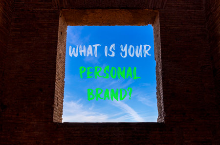 What is your personal brand symbol. Concept words What is your personal brand on window in ancient brick wall. Beautiful blue sky background. Business what is your personal brand concept. Copy space.の写真素材