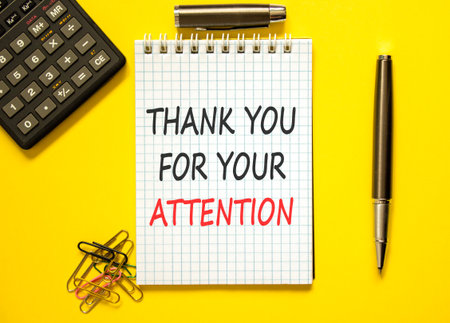 Thank you for your attention symbol. Concept words Thank you for your attention on beautiful note. Beautiful yellow background. Black pen. Business thank you for your attention concept. Copy space.の写真素材