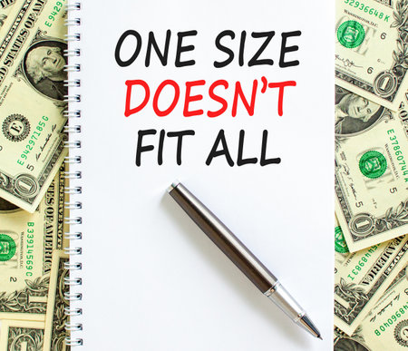 One size does not fit all symbol. Concept words One size does not fit all on beautiful white note. Beautiful dollar bills background. Business one size does not fit all concept. Copy space.の写真素材