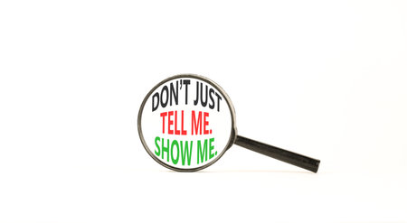 Tell or show symbol. Concept words Do not just tell me, show me on beautiful magnifying glass....