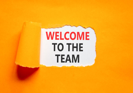 Support, help welcome to the team symbol. Concept words Welcome to the team on beautiful white paper. Beautiful orange paper background. Business welcome to the team concept. Copy space.の写真素材