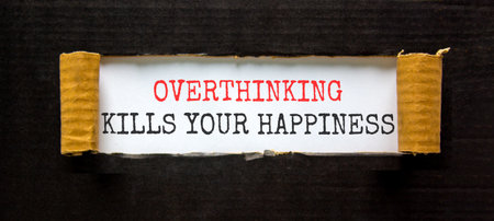 Overthinking kills your happiness symbol. Concept words Overthinking kills your happiness on white paper. Beautiful black paper background. Business overthinking kills happiness concept. Copy space.の写真素材