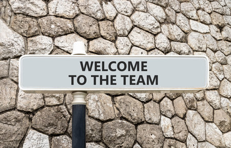 Support, help welcome to the team symbol. Concept words Welcome to the team on gray beautiful road sign. Beautiful stone wall background. Business welcome to the team concept. Copy space.の写真素材