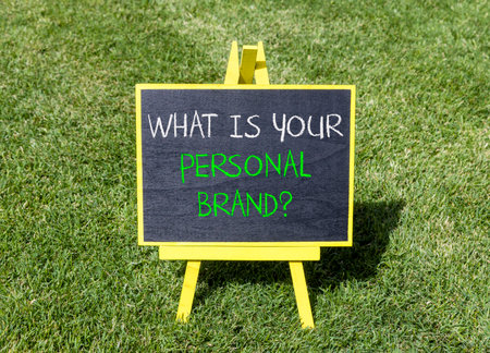 What is your personal brand symbol. Concept words What is your personal brand on beautiful blackboard. Beautiful green grass lawn background. Business what is your personal brand concept. Copy space.の写真素材