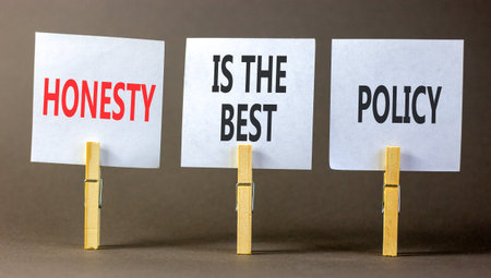 Honesty is the best policy. Concept words Honesty is the best policy on beautiful white papers on clothespin. Beautiful gray background. Business honesty is the best policy concept Copy spaceの写真素材