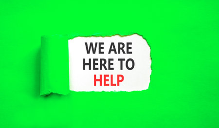 Support, help and we are here to help symbol. Concept words We are here to help on beautiful white paper. Beautiful green paper background. Business we are here to help concept. Copy space.の写真素材