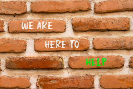 Support, help and we are here to help symbol. Concept words We are here to help on beautiful brick wall. Beautiful brick wall background. Business we are here to help concept. Copy space.の写真素材