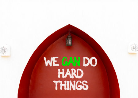 Support, help we can do hard things symbol. Concept words We can do hard things on beautiful red wall. Beautiful white wall background. Business we can do hard things concept. Copy space.の写真素材