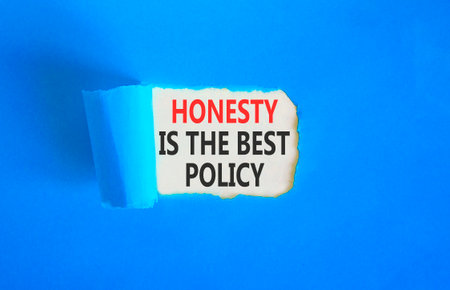 Honesty is the best policy. Concept words Honesty is the best policy on beautiful white paper. Beautiful blue paper background. Business honesty is the best policy concept. Copy space.の写真素材