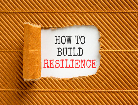 How to build resilience symbol. Concept words How to build resilience on beautiful white paper. Beautiful brown paper background. Business how to build resilience concept. Copy space.の写真素材