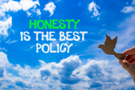 Honesty is the best political symbol. Concept words Honesty is the best policy on beautiful sky. Beautiful blue sky background. Businessman's hand. Business honesty is the best policy concept. Copy space.の写真素材
