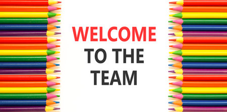 Support, help welcome to the team symbol. Concept words Welcome to the team on beautiful white paper. Beautiful white background. Colored pencils. Business welcome to the team concept. Copy space.の写真素材