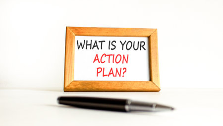 What is your action plan symbol. Concept words What is your action plan on beautiful wooden picture frame. Beautiful white background. Black pen. Business what is your action plan concept. Copy space.の写真素材
