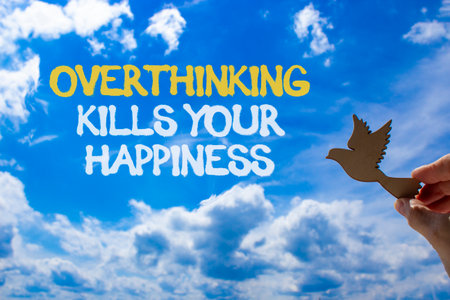 Overthinking kills your happiness symbol. Concept words Overthinking kills your happiness on blue sky. Beautiful blue sky background. Business overthinking kills happiness concept. Copy space.の写真素材