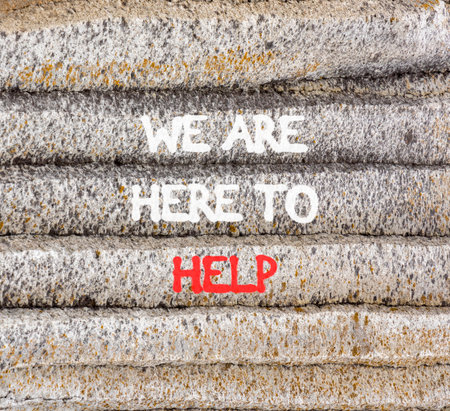 Support, help and we are here to help symbol. Concept words We are here to help on beautiful gray mountain. Beautiful gray mountain background. Business we are here to help concept. Copy space.の写真素材