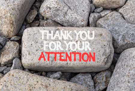 Thank you for your attention symbol. Concept words Thank you for your attention on beautiful gray stone. Beautiful gray stones background. Business thank you for your attention concept. Copy space.の写真素材