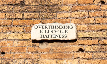 Overthinking symbol. Concept words Overthinking on sign plate. Beautiful brick wall background. Business overthinking concept. Copy space.の写真素材