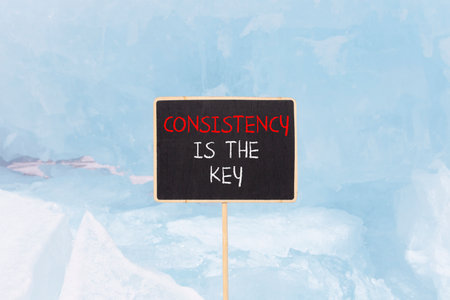 Consistency is the key symbol. Concept words Consistency is the key on beautiful blackboard....