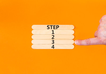 Time to step 3 symbol. Concept word Step 1 2 3 4 on beautiful wooden sticks. Businessman's hand....
