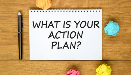What is your action plan symbol. Concept words What is your action plan on beautiful white note. Beautiful wooden background. Black pen. Business what is your action plan concept. Copy space.の写真素材