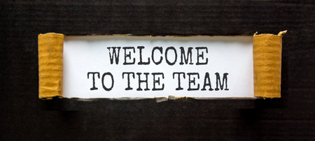 Support, help welcome to the team symbol. Concept words Welcome to the team on beautiful white paper. Beautiful black paper background. Business welcome to the team concept. Copy space.の写真素材