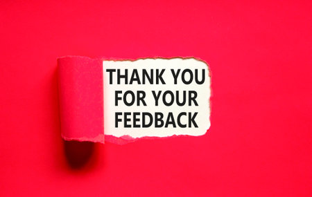 Thank you for your feedback symbol. Concept words Thank you for your feedback on beautiful white paper. Beautiful red paper background. Business thank you for your feedback concept. Copy space.の写真素材