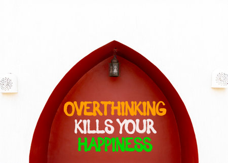 Overthinking kills your happiness symbol. Concept words Overthinking kills your happiness on red wall. Beautiful white wall background. Business overthinking kills happiness concept. Copy space.の写真素材