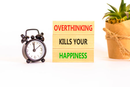 Overthinking kills your happiness symbol. Concept words Overthinking kills your happiness on wooden blocks. Beautiful white background. Business overthinking kills happiness concept. Copy space.の写真素材