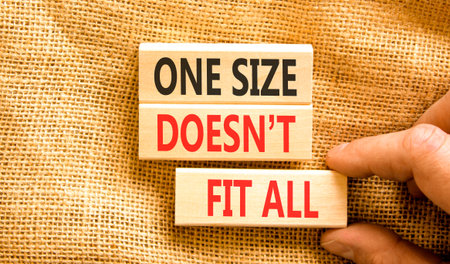 One size does not fit all symbol. Concept words One size does not fit all on beautiful wooden blocks. Beautiful canvas background. Business one size does not fit all concept. Copy space.の写真素材
