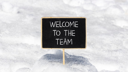 Support, help welcome to the team symbol. Concept words Welcome to the team on beautiful blackboard. Beautiful white snow background. Business welcome to the team concept. Copy space.の写真素材