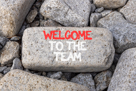 Support, help welcome to the team symbol. Concept words Welcome to the team on beautiful gray stone. Beautiful gray stones background. Business welcome to the team concept. Copy space.の写真素材