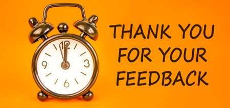 Thank you for your feedback symbol. Concept words Thank you for your feedback on beautiful orange paper. Beautiful orange paper background. Business thank you for your feedback concept. Copy space.の写真素材
