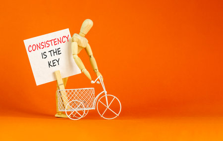 Consistency is the key symbol. Concept words Consistency is the key on beautiful white paper....