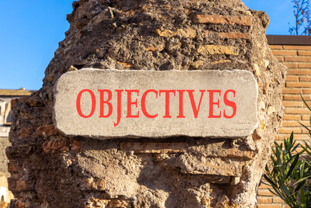 Objectives symbol. Concept words Objectives on beautiful white marble sign plate. Beautiful ancient...