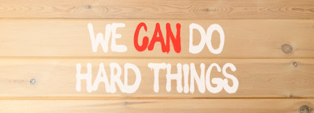 Support, help we can do hard things symbol. Concept words We can do hard things on beautiful wooden...