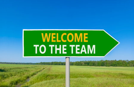 Support, help welcome to the team symbol. Concept words Welcome to the team on beautiful green road...