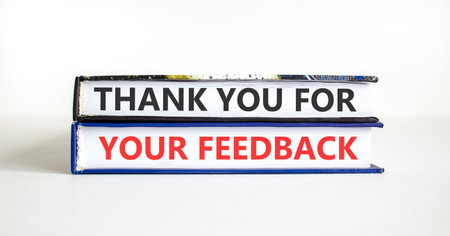 Thank you for your feedback symbol. Concept words Thank you for your feedback on beautiful books. Beautiful white paper background. Business thank you for your feedback concept. Copy space.の写真素材