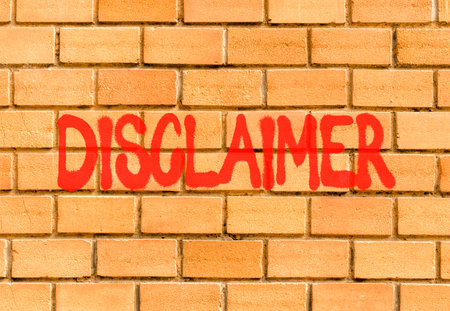 Disclaimer symbol. Concept word Disclaimer on beautiful big brown brick wall. Beautiful big brown brick wall background. Business disclaimer concept. Copy space.の写真素材