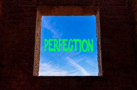 Perfection symbol. Concept word Perfection on beautiful blue sky in window. Beautiful brick wall with window and blue sky background. Business perfection concept. Copy space.の写真素材