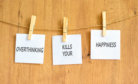 Overthinking kills your happiness symbol. Concept words Overthinking kills your happiness on white papers. Beautiful wooden background. Business overthinking kills happiness concept. Copy space.の写真素材