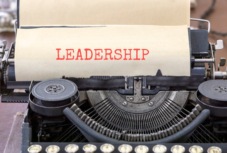Leadership symbol. Concept word Leadership typed on beautiful old retro typewriter. Beautiful white...