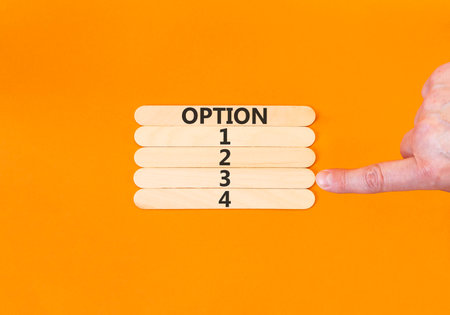 Time to option 3 symbol. Concept word Option 1 2 3 4 on beautiful wooden sticks. Businessman's hand....