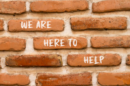Support, help and we are here to help symbol. Concept words We are here to help on beautiful brick wall. Beautiful brick wall background. Business we are here to help concept. Copy space.の写真素材