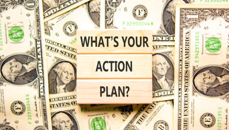 What is your action plan symbol. Concept words What is your action plan on beautiful wooden blocks. Beautiful dollar bills background. Business what is your action plan concept. Copy space.の写真素材