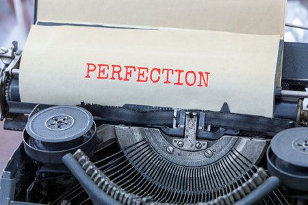 Perfection symbol. Concept word Perfection typed on beautiful old retro typewriter. Beautiful white...