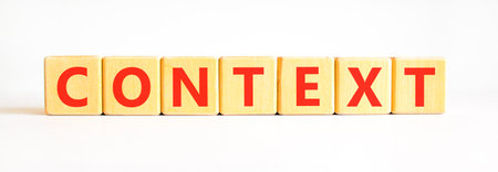 Context symbol. Concept word Context on beautiful wooden blocks. Beautiful white background. Business context concept. Copy space.の写真素材