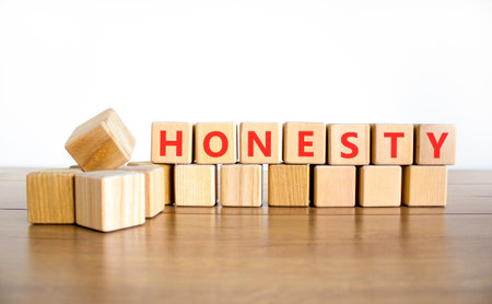 Honesty word symbol. Concept word Honesty on beautiful wooden blocks. Beautiful wooden table white background. Business honesty concept. Copy space.の写真素材